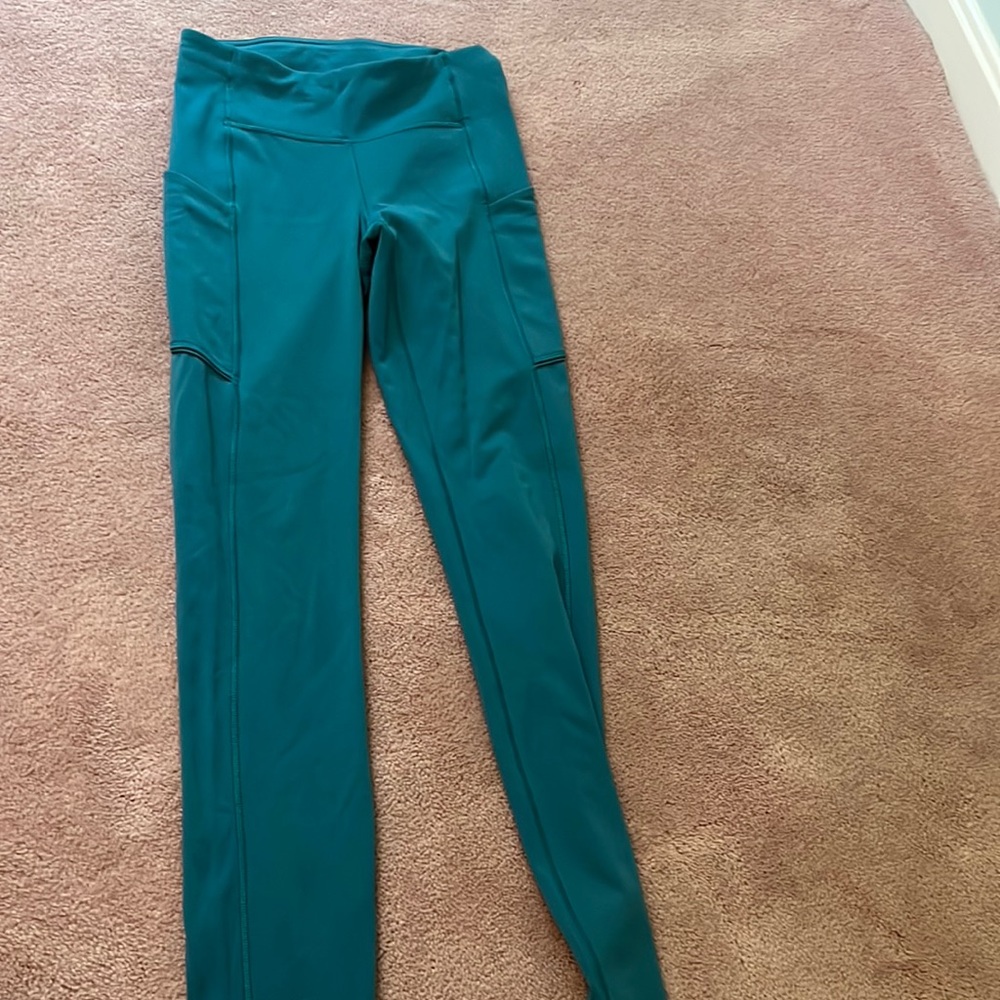 size 2 turquoise leggings with pocket and back zipper “28